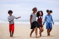 Funny vacation. Children or kids playing and romp together at the beach on holiday. Having fun after unlocking down the city from Royalty Free Stock Photo