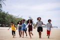 Funny vacation. Children or kids playing and romp together at the beach on holiday. Having fun after unlocking down the city from Royalty Free Stock Photo