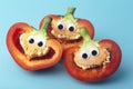 Funny vegetables for kids. Cheerful Peppers with eyes and smiles. Food for kids concept Royalty Free Stock Photo