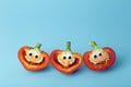 Funny vegetables for kids. Cheerful Peppers with eyes and smiles. Food for kids concept