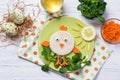 Funny vegetables, sandwich in a shape of chick, food for kids Easter idea, top view