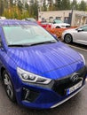 Funny view of blue electric car hood with rain drops and water tracks Royalty Free Stock Photo