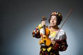 The funny violin clown player in musical concept