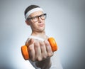 Funny weak man lifting biceps Royalty Free Stock Photo