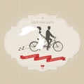 Funny wedding invitation with bride and groom riding tandem bicycle Royalty Free Stock Photo