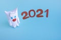 Funny white bull made of paper and toilet roll on a blue background.New year`s fantasy. New year according to the Chinese calenda