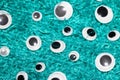 Funny Wiggle Google Eyes on Fabric Background