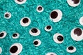 Funny Wiggle Google Eyes on Fabric Background