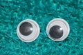 Funny Wiggle Google Eyes on Fabric Background