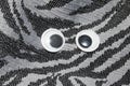 Funny Wiggle Google Eyes on Fabric Background Royalty Free Stock Photo