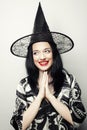 Funny Witch. Young happy woman with canival hat.