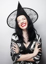 Funny Witch. Young happy woman with canival hat. Royalty Free Stock Photo