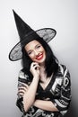 Funny Witch. Young happy woman with canival hat. Royalty Free Stock Photo