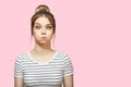 Funny woman blowing cheeks. pink background Royalty Free Stock Photo