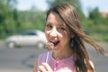 Funny woman eating a chocolate candy. Royalty Free Stock Photo