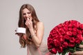 Funny woman eating sweets and running away from bouquet