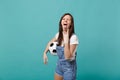 Funny woman football fan cheer up support favorite team with soccer ball showing tongue heavy metal rock sign isolated Royalty Free Stock Photo