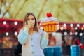 Funny Woman Holding a Big Cupcake Feeling Sick