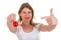 Funny woman holding cherry tomato Royalty Free Stock Photo