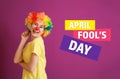 Funny woman with party decor for April Fools\' Day on color background Royalty Free Stock Photo