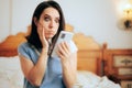 Funny Woman in Shock Reading Text Message on her Phone Royalty Free Stock Photo