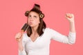 Funny woman singing with comb. Brushing Hair. Portrait young woman brushing straight natural hair with comb. Girl