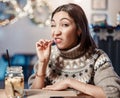 Woman smiles, winks and picks her teeth with a toothpick on a first date. Concept of bad manners and bad habits, as well as Royalty Free Stock Photo