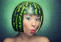 Funny woman with water-melon as helmet Royalty Free Stock Photo