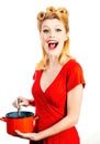 Funny woman winking in the kitchen and cooking, Royalty Free Stock Photo