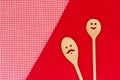 Funny wooden spoons on tablecloth