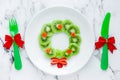 Funny xmas food idea for kids - kiwi strawberry edible Christmas wreath