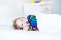 Funny yawning toddler girl waking up in morning Royalty Free Stock Photo