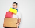 Funny Young Asian Guy Holding Lots of Gift Box