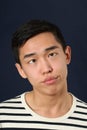 Funny young Asian man making face Royalty Free Stock Photo