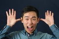 Funny young Asian man making face Royalty Free Stock Photo