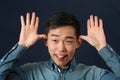 Funny young Asian man making face Royalty Free Stock Photo