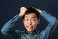 Funny young Asian man making face Royalty Free Stock Photo