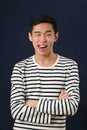 Funny young Asian man showing his tongue Royalty Free Stock Photo