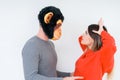 Funny young couple, boyfriend wearing monkey mask, crazy and idiot relationship in love