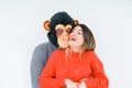 Funny young couple, boyfriend wearing monkey mask, crazy and idiot relationship in love