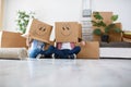 Funny young couple enjoy and celebrating moving to new home Royalty Free Stock Photo