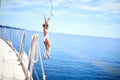 Funny Girl jumping from sailing boat in sea Royalty Free Stock Photo