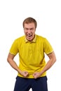 Funny young guy in casual yellow T-shirt raising hands successful and aggressive isolated on white