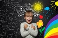 Funny young kid girl on blackboard background with science and arts pattern. Creativity education, new ideas and right and left Royalty Free Stock Photo