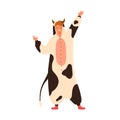 Funny young man dancing in cow kigurumi at carnival party. Male performer wearing animal costume. Cheerful comedian in