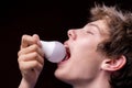 funny young man eat light bulb, joke concept, funny guys Royalty Free Stock Photo