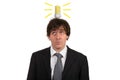 Funny young man with light bulb over his head, isolated on white background Royalty Free Stock Photo