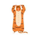 Funny young man wearing tiger kigurumi for pagama party. Male character standing in animal costume. Cheerful guy in cozy Royalty Free Stock Photo