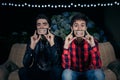 Funny young men holding smartphones showing female Royalty Free Stock Photo