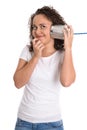 Funny young smiling girl listening on tin can phone. Royalty Free Stock Photo